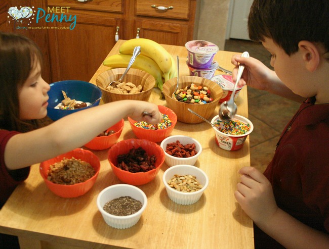 A quick and easy after school snack... create a yogurt bar where the kids can top their favorite yogurt with lots of goodies. #ad #SnackandSmile 