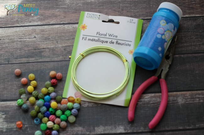 Missing bubble wand? No problem! Make an adorable but homemade bubble wand using items from the dollar store.