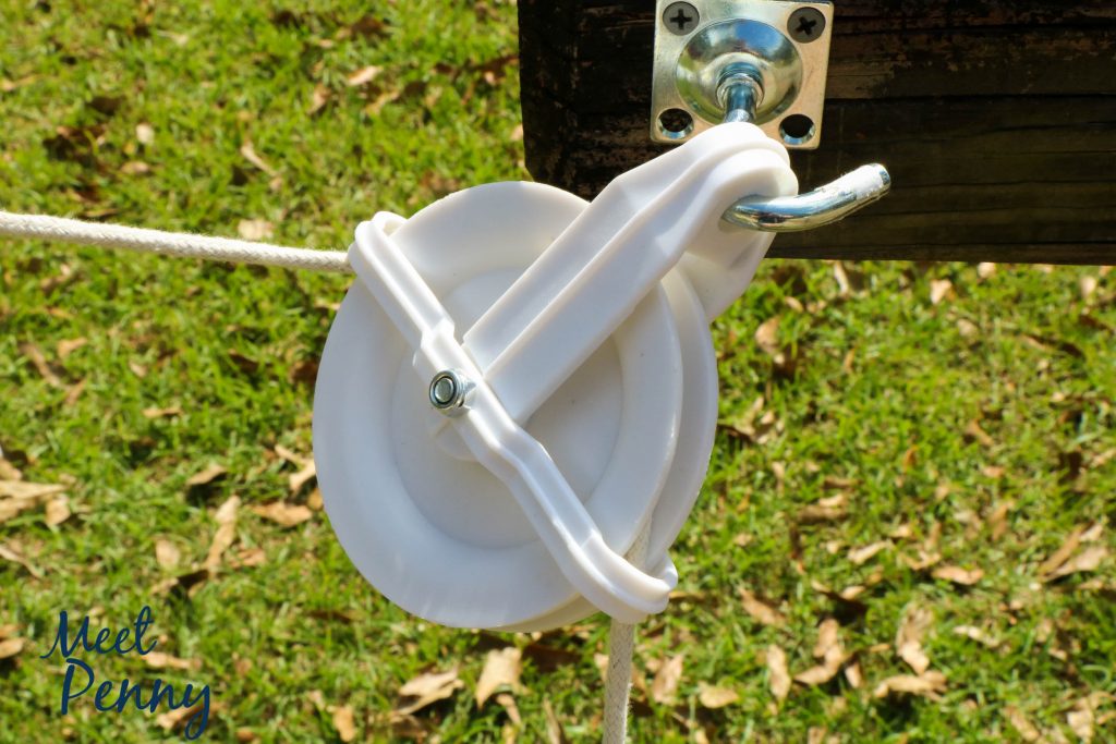 This Halloween candy delivery system is super easy to create. You only need a few things to make a socially-distanced Halloween pulley system for candy.